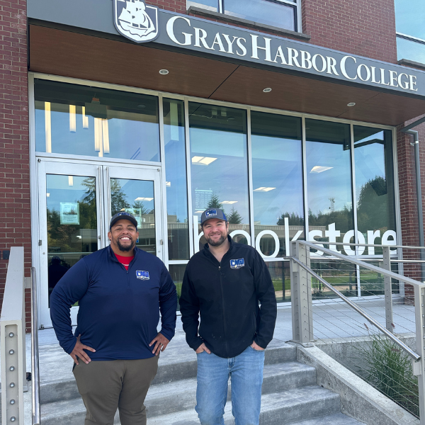 Alumni Chris Miller (right) and Marcus Nathaniel (left) returned to GHC with their company CMD Sign & Electric Inc. to install the signage on the bookstore’s new location in the tulalW Student Center. Chris graduated from GHC with an AA-T in Carpentry and Marcus graduated with an AA-S in Business Management.