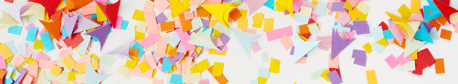 Table with construction paper cut outs in shapes