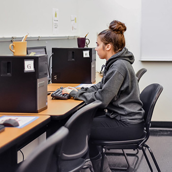 A student taking a placement test on a computer